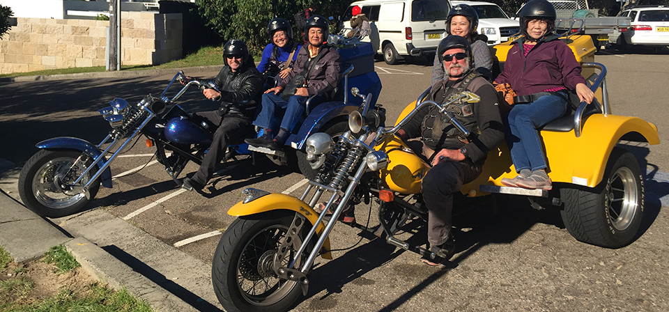 Family riding side-by-side trikes on a Troll Tours trike tour