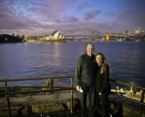 A stunning Sydney sunset trike tour with the Opera House and Harbour Bridge in the background.